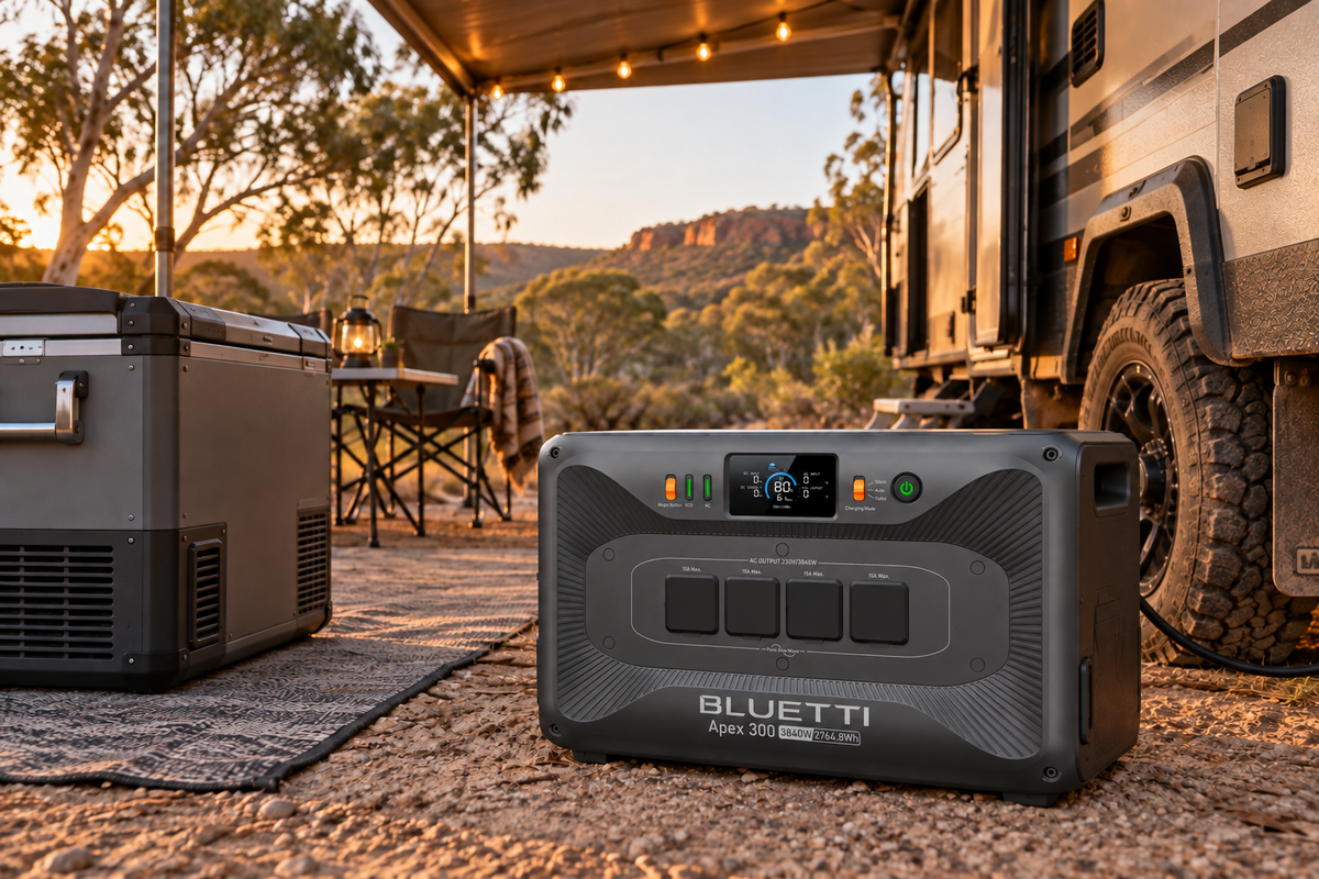 BLUETTI APEX 300 beside an off-road caravan at an Australian bush campsite