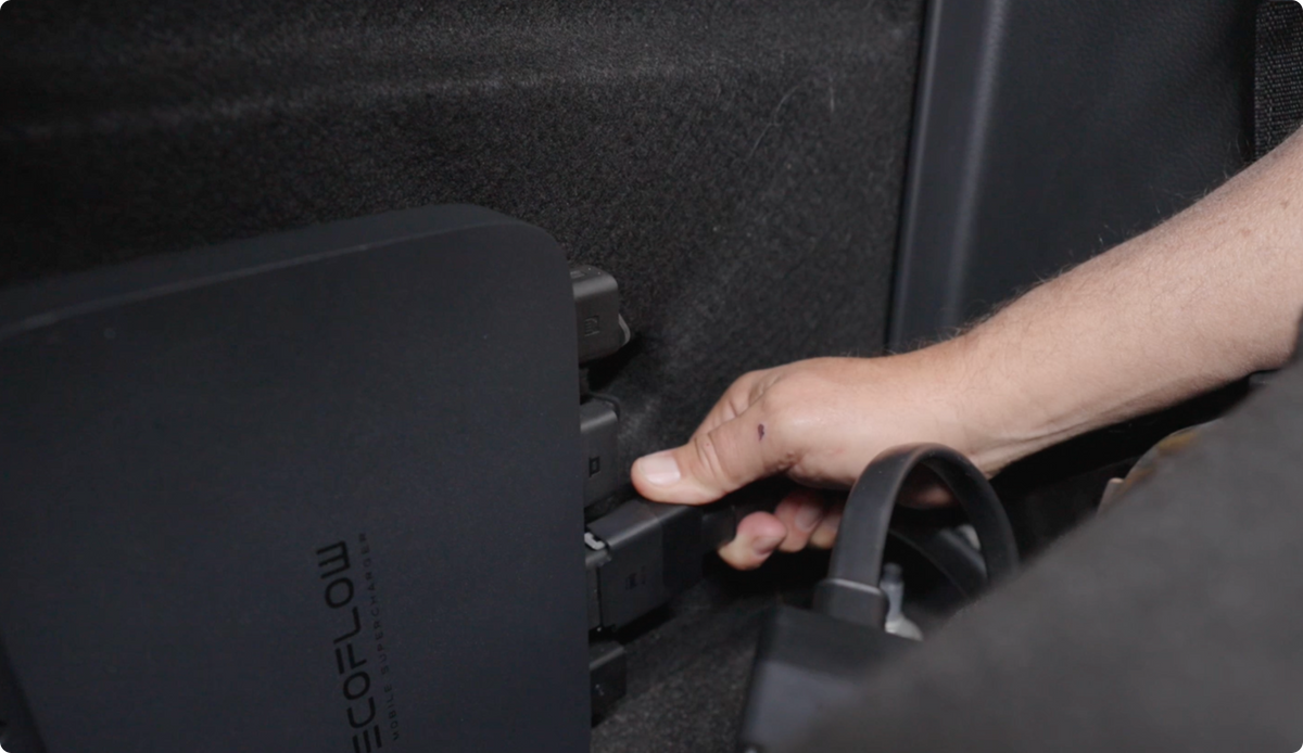EcoFlow 800W Alternator Charger mounted inside a vehicle with output cable connected; vehicle and installation not included.